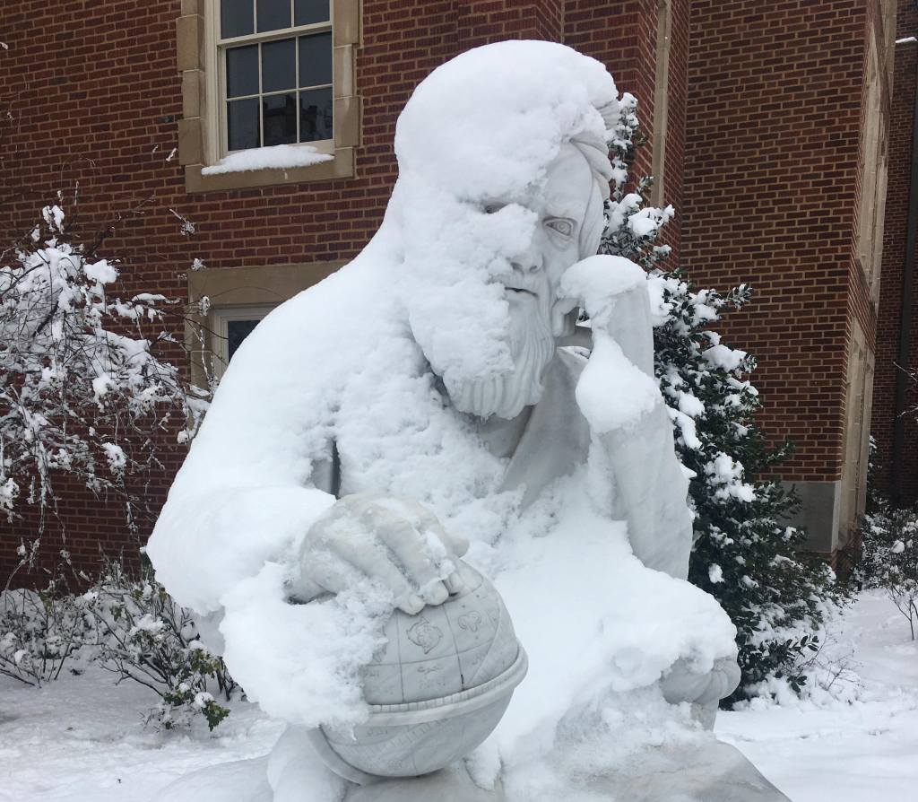 Statue of Omar Khayyam covered in snow